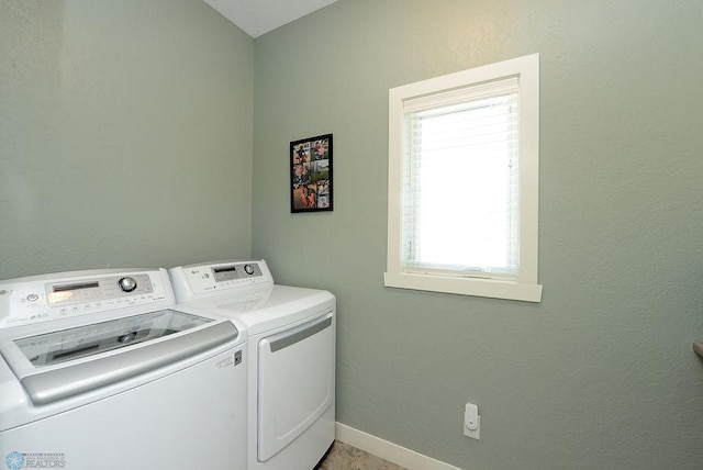 washroom featuring washer and dryer