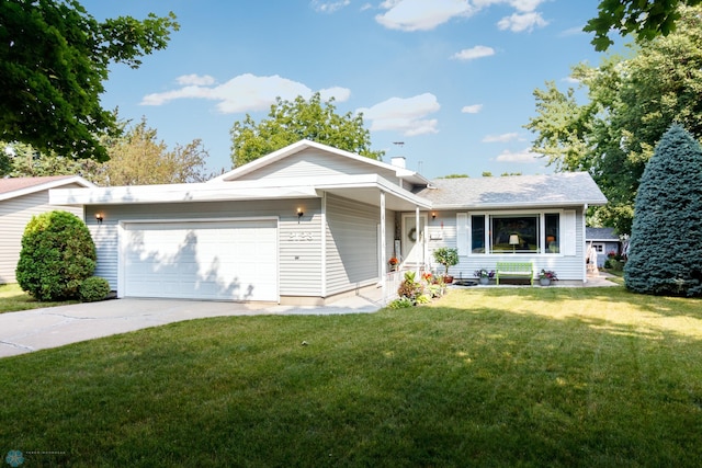 view of front of house with a garage and a front lawn