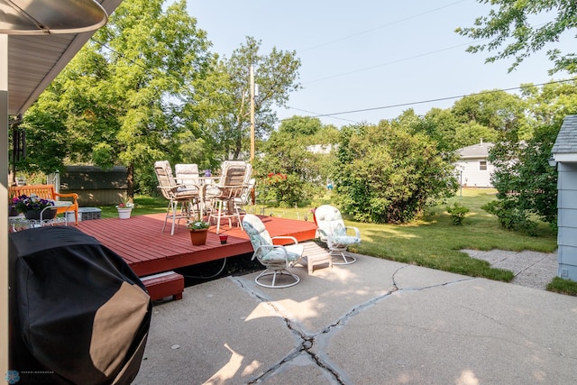 view of patio with a grill and a wooden deck