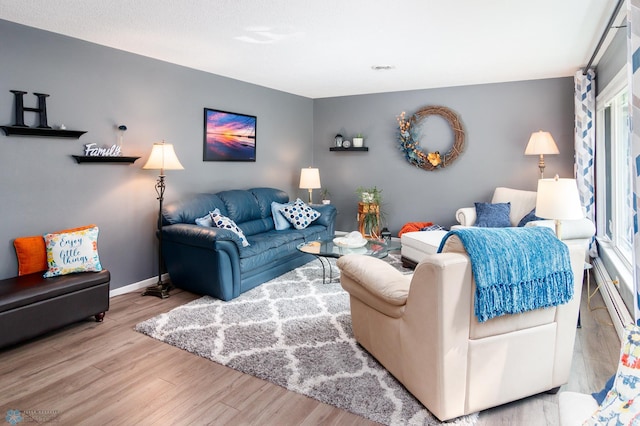 living room featuring light hardwood / wood-style floors and plenty of natural light