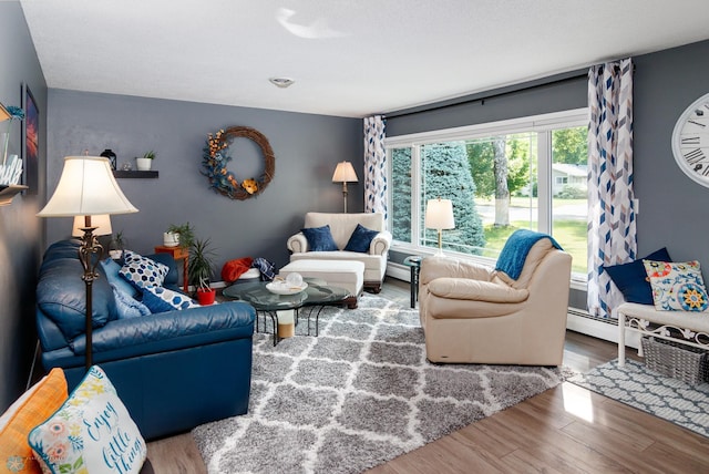 living room featuring a baseboard radiator and hardwood / wood-style flooring