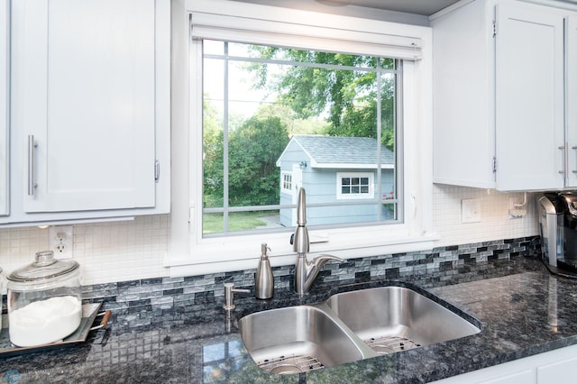 kitchen featuring sink, a wealth of natural light, and white cabinets