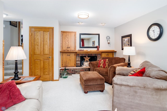 carpeted living room with a brick fireplace