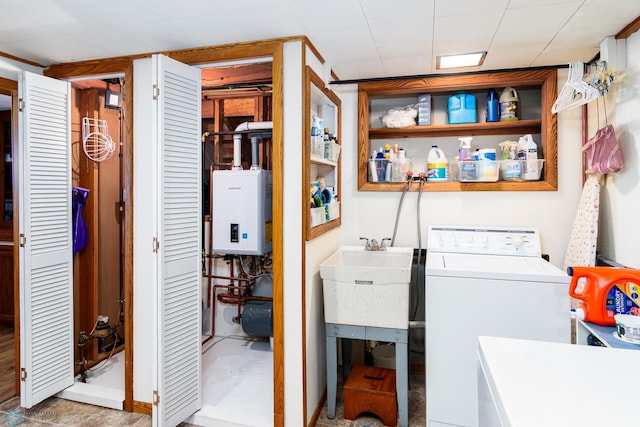 washroom featuring washer / dryer and tankless water heater