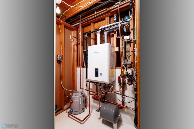 utility room featuring tankless water heater