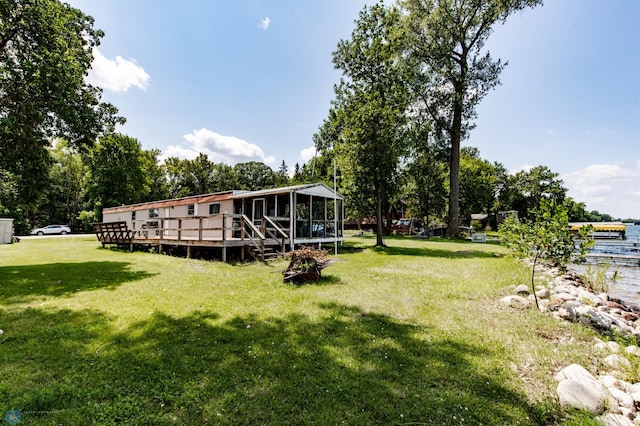 view of yard with a wooden deck