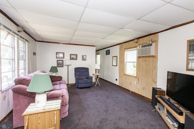 living room with carpet, plenty of natural light, and a paneled ceiling