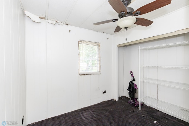 spare room featuring carpet flooring and ceiling fan