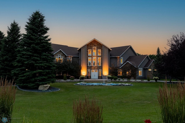 view of front of property with a lawn