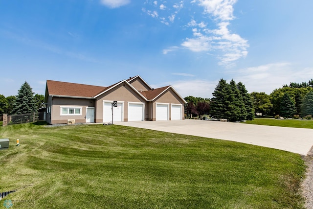 view of front facade featuring a garage and a front lawn