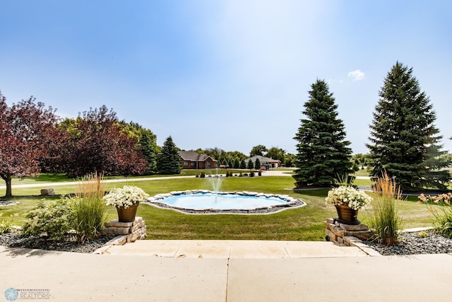 view of community with a lawn