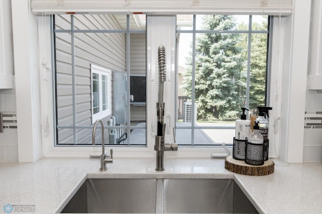 details featuring light stone countertops