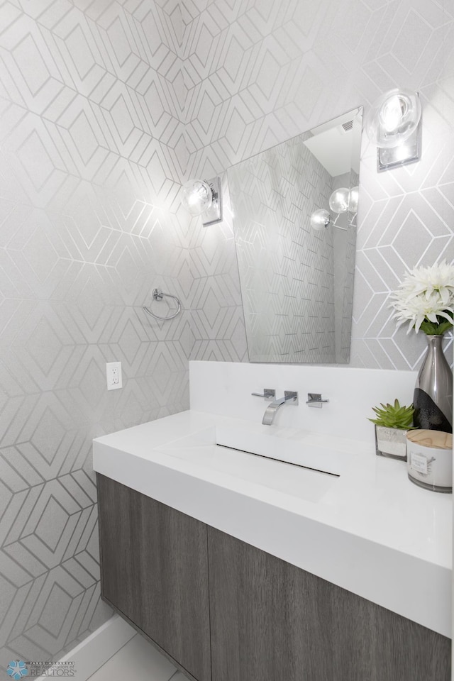 bathroom with a shower and vanity