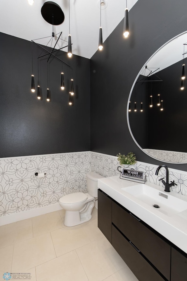 bathroom with tile patterned floors, toilet, and vanity