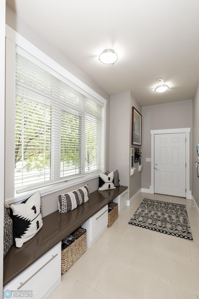 mudroom featuring light tile patterned flooring