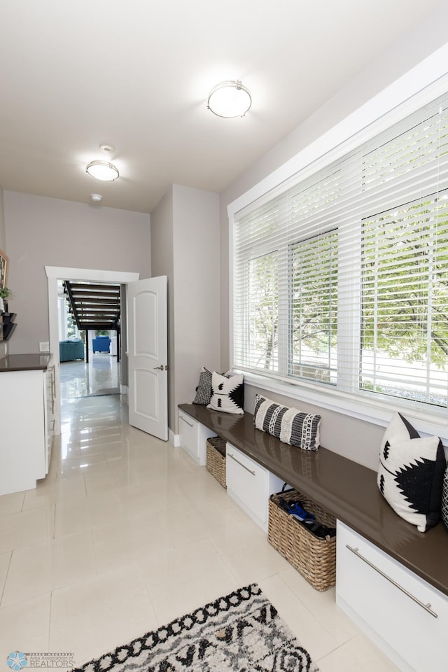 mudroom with light tile patterned floors