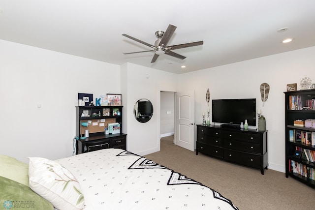 bedroom featuring light carpet and ceiling fan