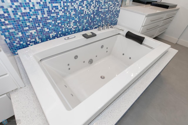 bathroom with tile walls and tile patterned floors