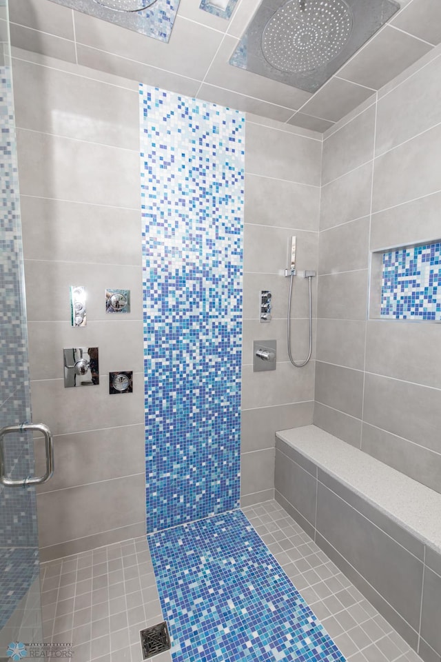 bathroom with a shower with shower door