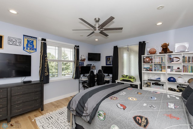 bedroom featuring light wood-type flooring and ceiling fan