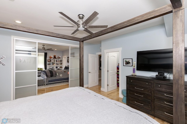 bedroom with ceiling fan and light hardwood / wood-style flooring