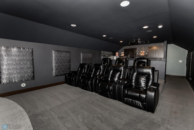 cinema room featuring carpet and lofted ceiling