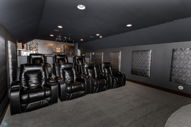 carpeted cinema featuring vaulted ceiling