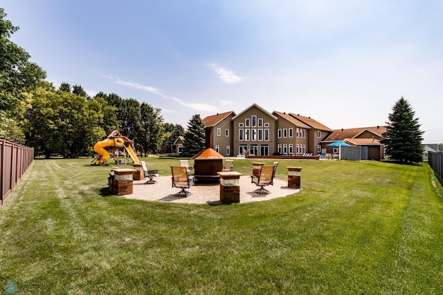 view of yard featuring a patio area and a playground