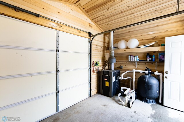 garage featuring wood walls and wood ceiling