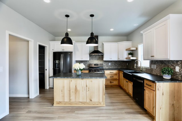 kitchen featuring a kitchen island, light wood-type flooring, tasteful backsplash, and black appliances