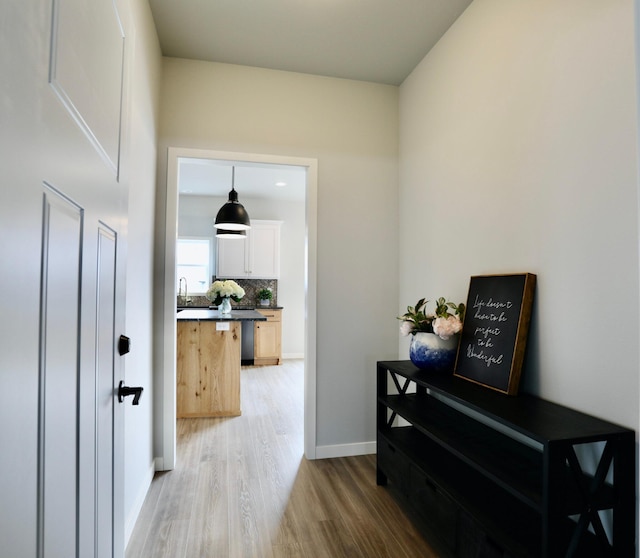 corridor featuring hardwood / wood-style flooring