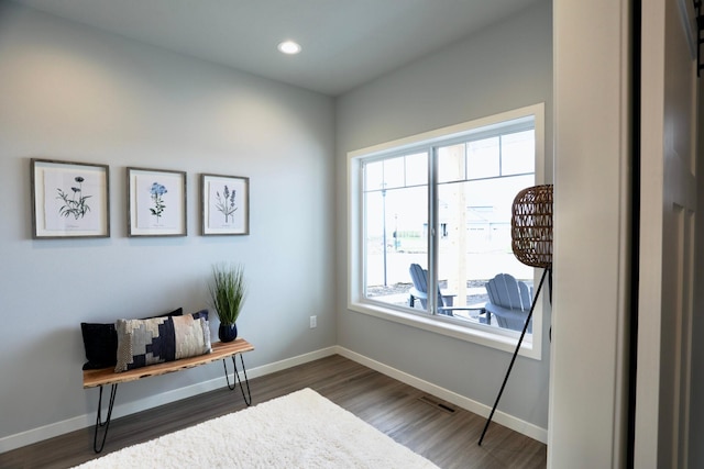 sitting room with hardwood / wood-style flooring and a wealth of natural light