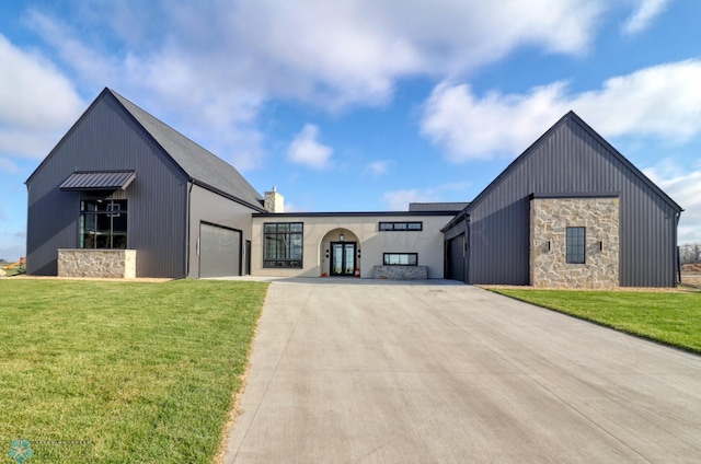 modern farmhouse with a garage and a front yard