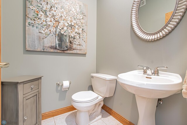 bathroom featuring toilet and tile patterned floors