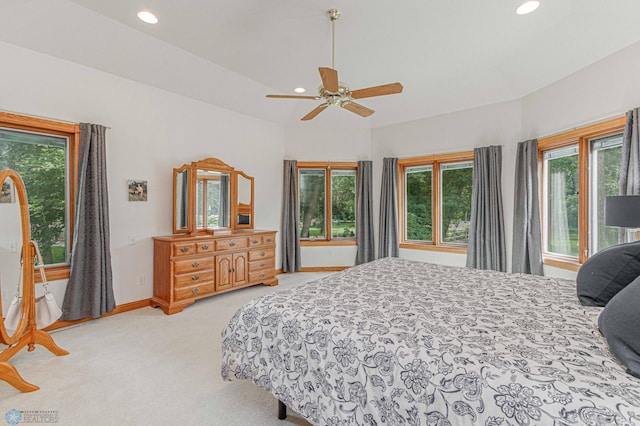 bedroom featuring light colored carpet and ceiling fan