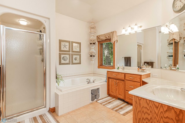 bathroom with vanity, shower with separate bathtub, and tile patterned floors