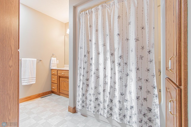 bathroom featuring vanity and tile patterned flooring