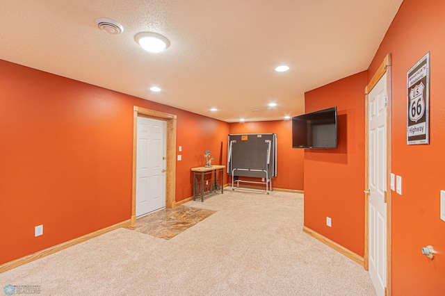 interior space with a textured ceiling