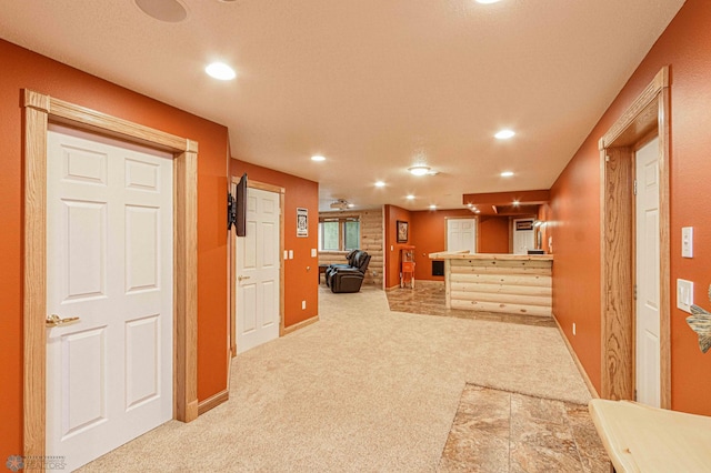 kitchen featuring light colored carpet