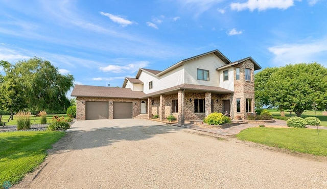 view of front of property with a front lawn and a garage