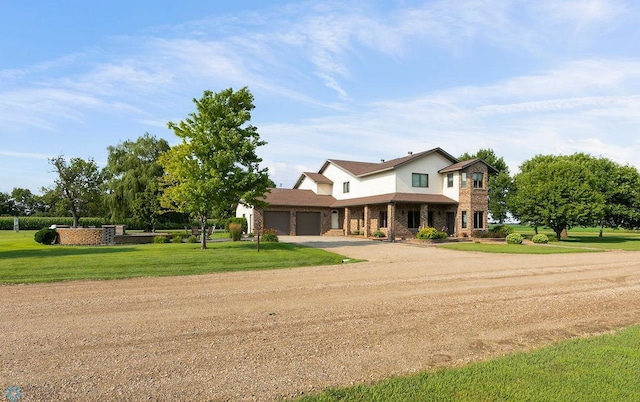 view of front facade with a front lawn and a garage