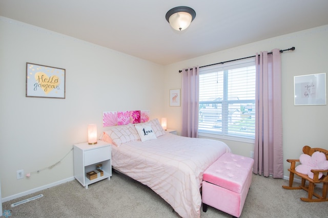 bedroom featuring light carpet