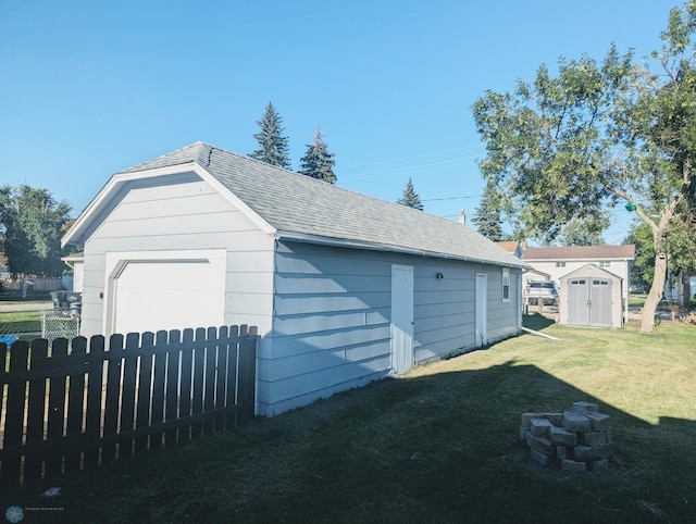 garage with a yard