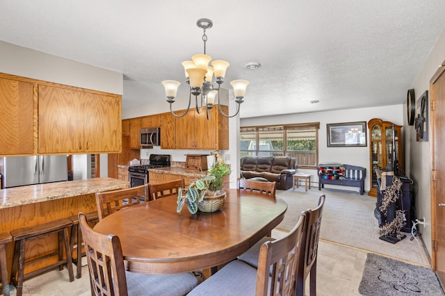 tiled dining area featuring a textured ceiling and a notable chandelier