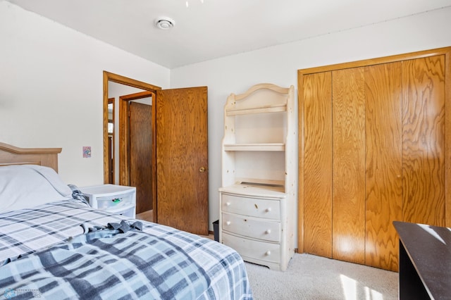 bedroom featuring carpet and a closet