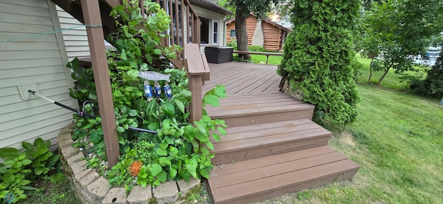 wooden terrace with a lawn