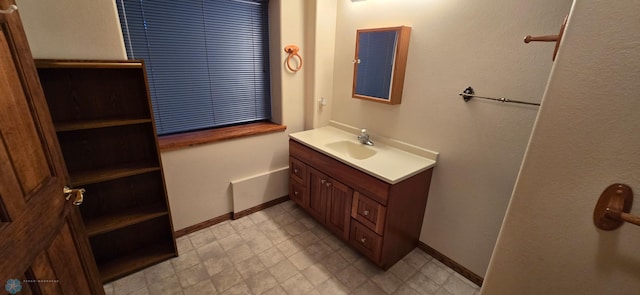 bathroom with vanity and tile patterned flooring