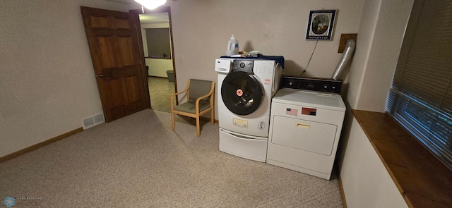 washroom with light colored carpet and independent washer and dryer