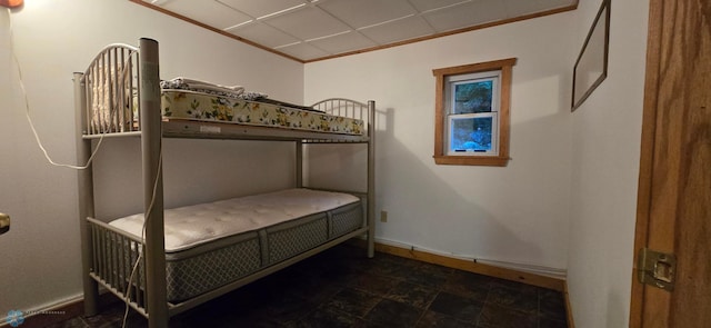 bedroom with dark tile patterned floors