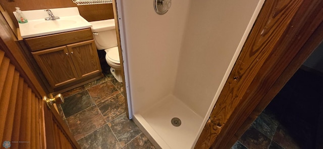 bathroom with vanity, tile patterned flooring, and toilet